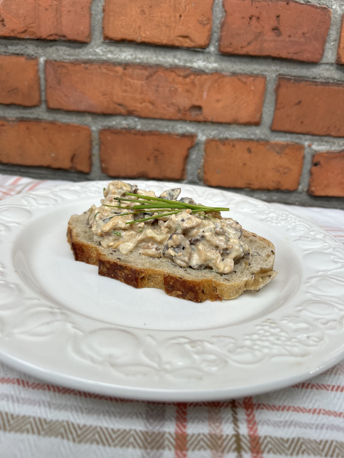 A cream-dressed lunch salad with pan-browned brown mushrooms, white asparagus, chives, and Sloppy Jo's Basic Filling, served on a plate